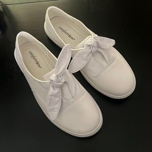 BRAND NEW!  White canvas slip on shoes with cute bow detail.